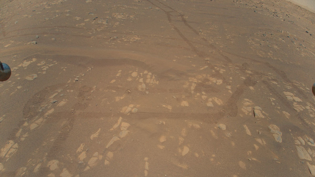 This is the first color image of Mars' surface taken by Ingenuity in flight.