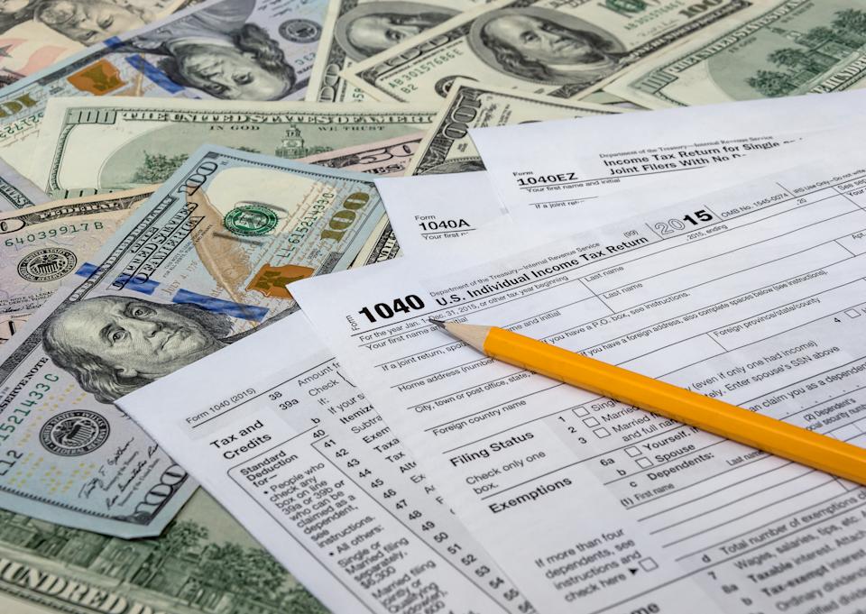 Billionaires, with a tax team at their command, always find a way to pay the least amount of tax possible.  Pictured is a US tax return form.  Photo: Getty Images. 