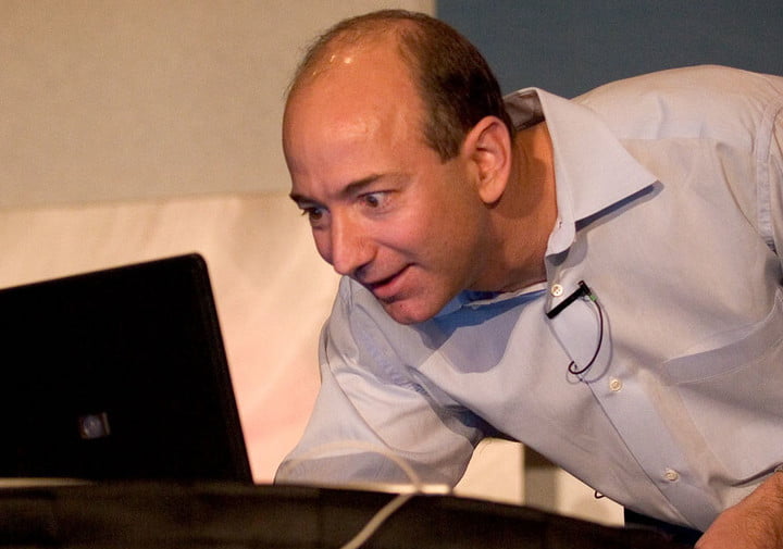 Jeff Bezos looking at the computer