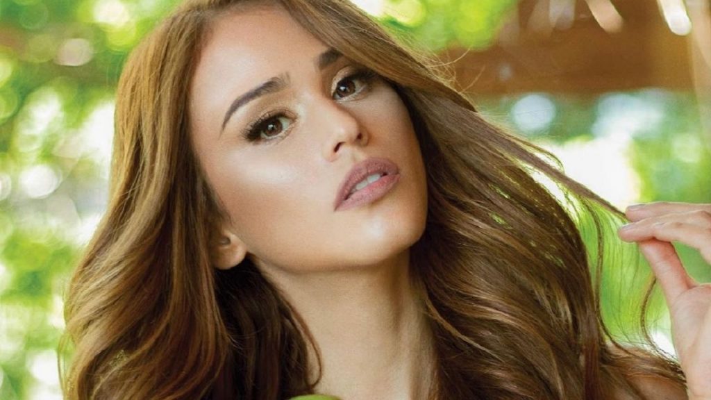 By the window, Yanet Garcia blew the nets to show her a unique silhouette