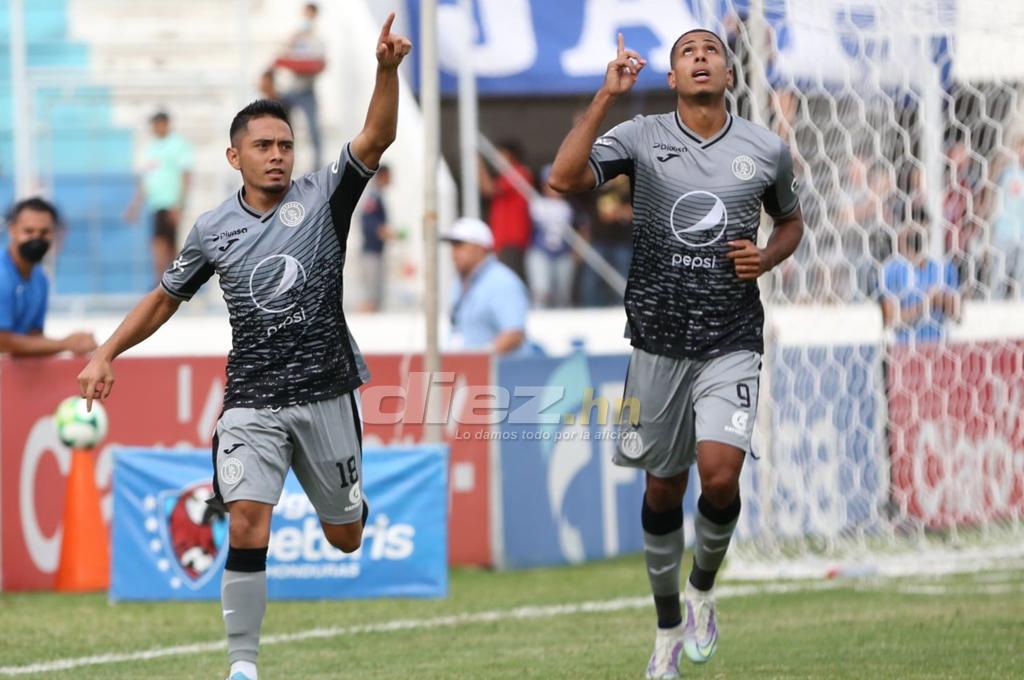 Eddie Hernandez and Diego Rodriguez celebrated the striker's slender goal when the match ended.  (photo by David Romero)