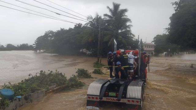 Images of a fire truck crossing a flooded area in Puerto Rico.