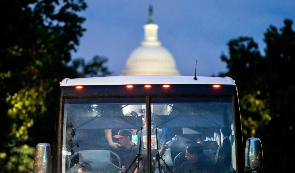 Immigrants from Texas on a bus near the Capitol in Washington on August 11, 2022.  (Credit: Stephanie Reynolds/AFP/Getty Images)
