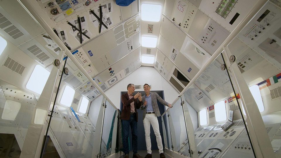 Joaquín, under the guidance of Pedro Duque, is encouraged to ride a 'Space Simulator', which recreates a journey to the International Space Station, and experience the feel of a 'Zero Gravity Cube'.  / GVA