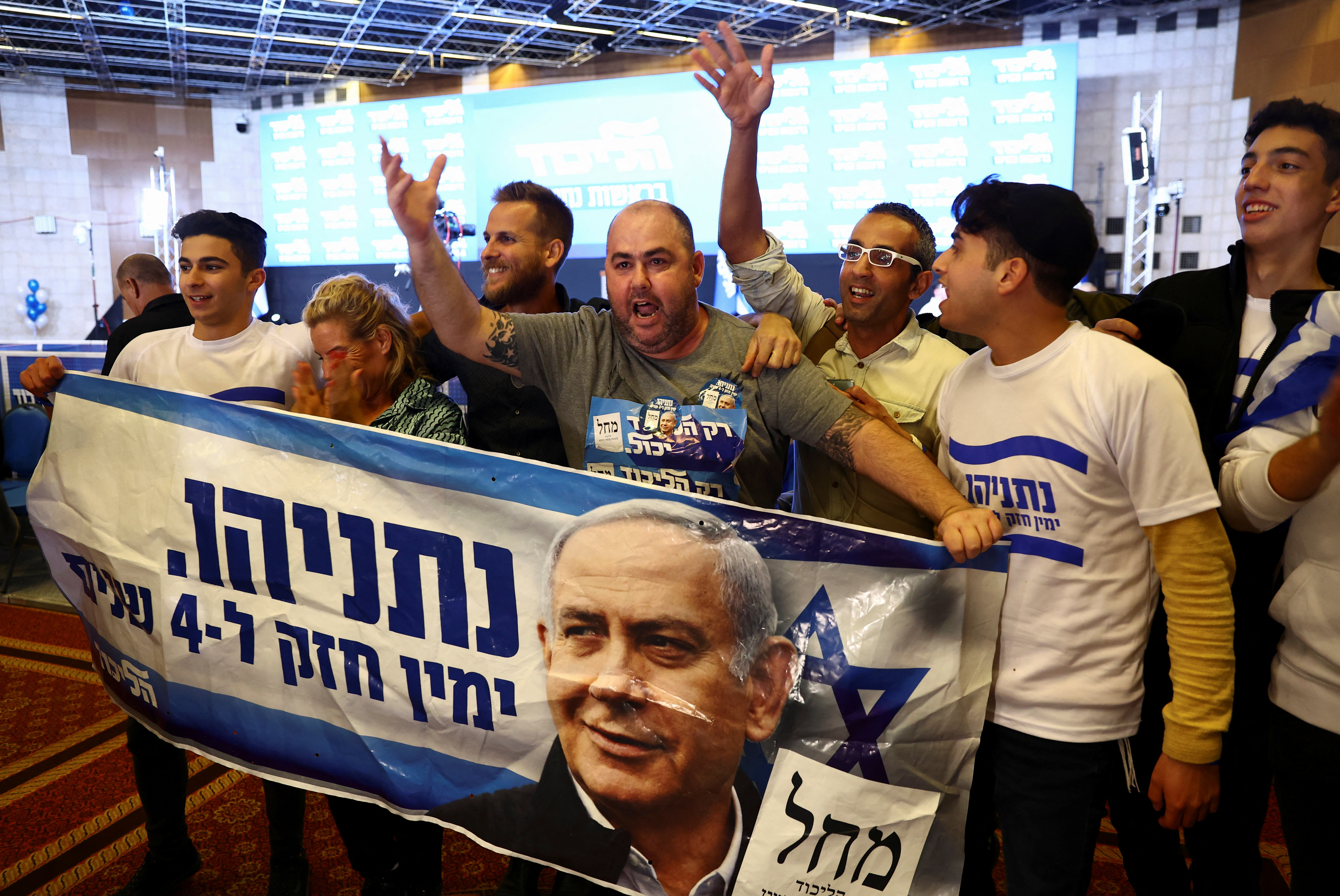 Supporters of Likud party leader Benjamin Netanyahu react after announcing the ballot boxes in the Israeli general elections, at the party headquarters in Jerusalem, November 1, 2022 (REUTERS/Ronen Zvulun)