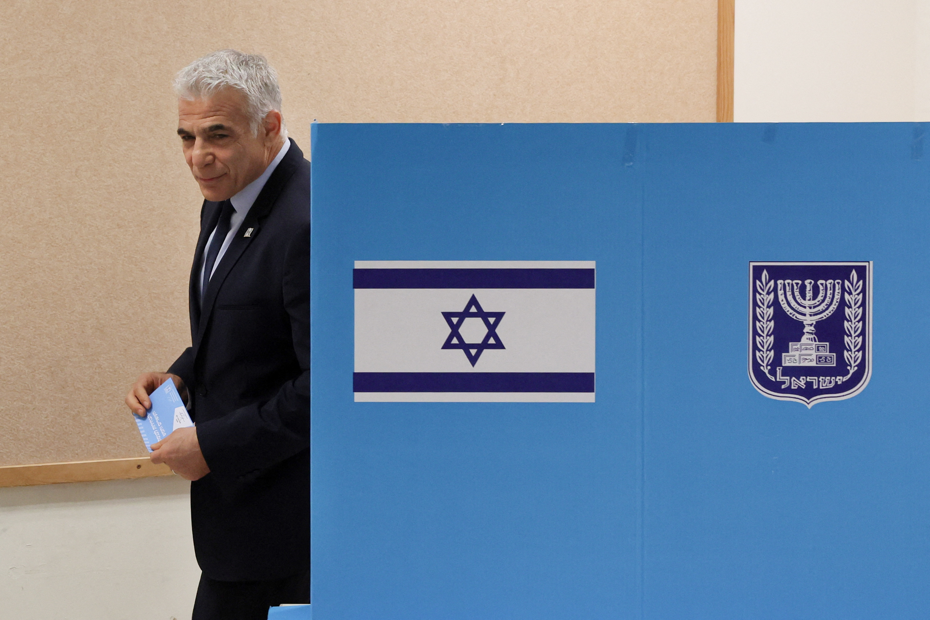 Israeli Prime Minister Yair Lapid casts his vote at a polling station in the coastal city of Tel Aviv, Israel (Reuters)