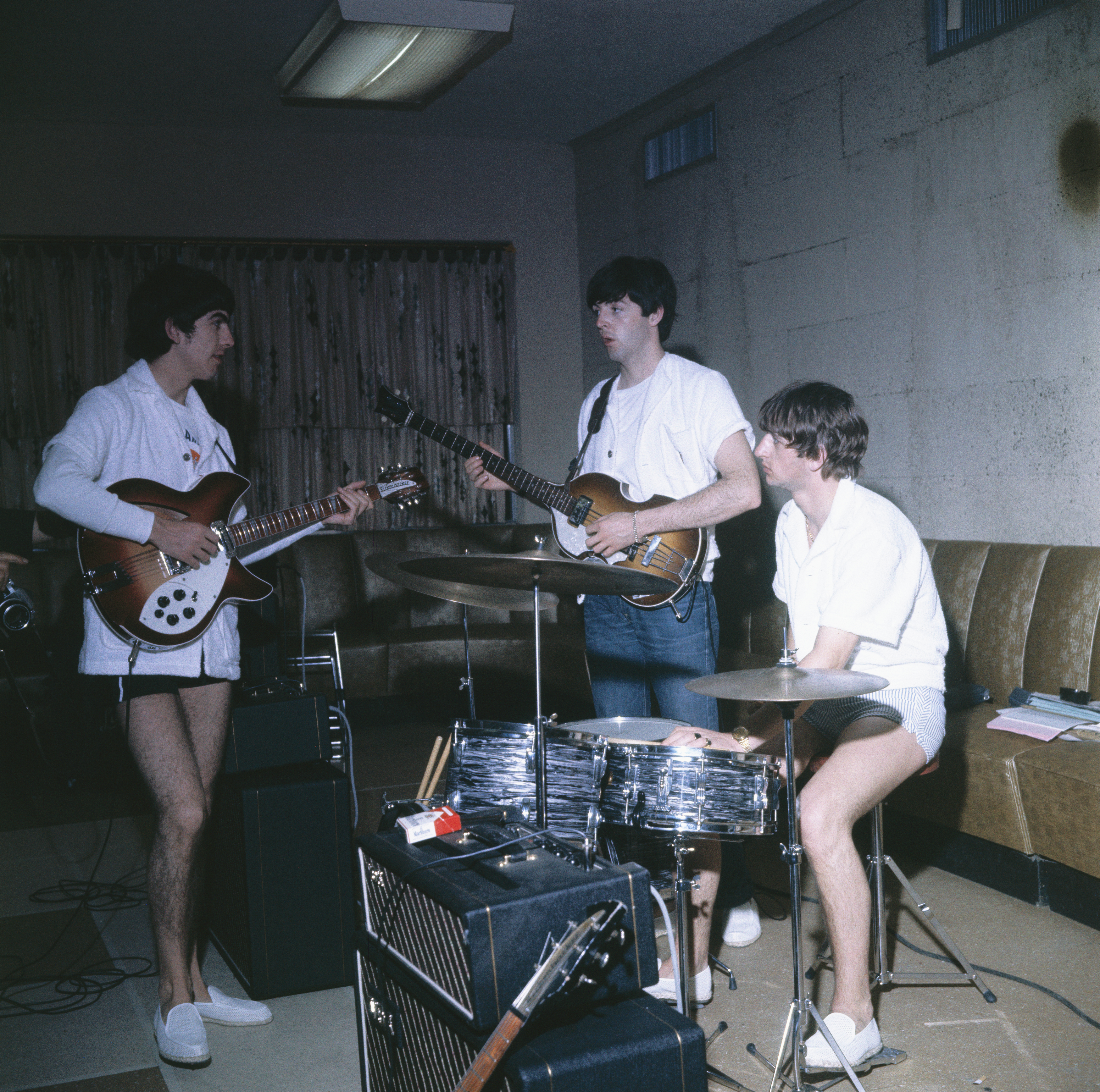 (Original Caption) Miami Beach, Fla.: The Beatles, in their bathing suits, rehearse at the Twoville Hotel for their next appearance on the Sullivan TV show.