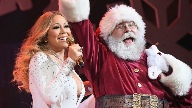 Mariah Carey with Santa Claus.