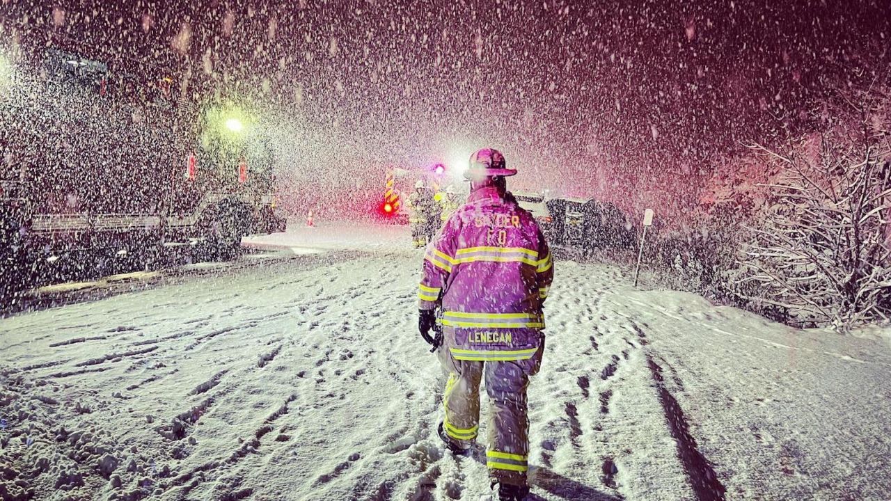 Firefighters in Snyder, New York, after responding to a car crash on I-290 on Thursday.
