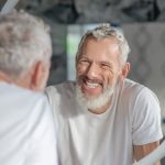 Can a smile, even if forced, lift our spirits?