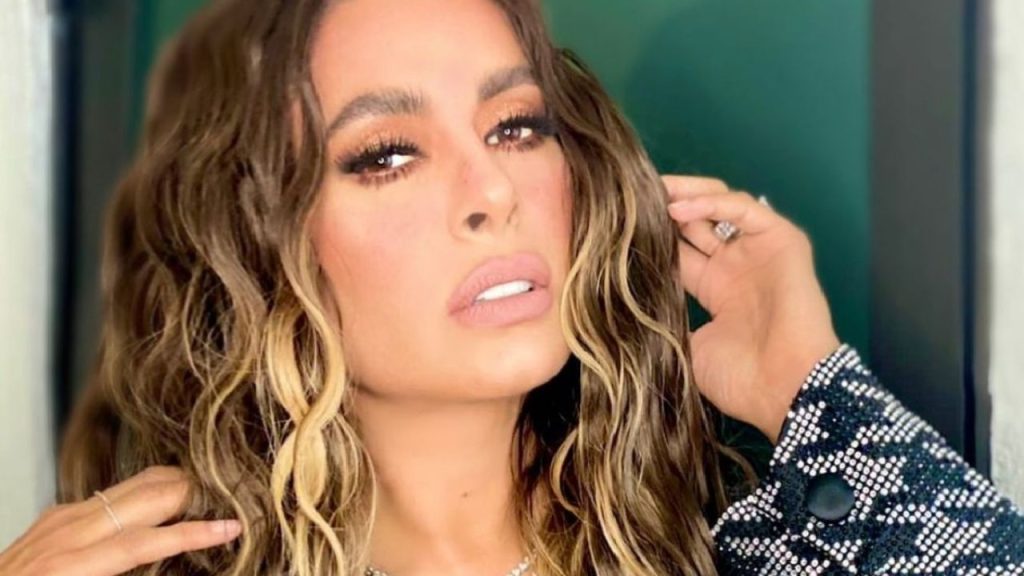 Galilea Montijo turns up the heat in a gold mini dress full of shimmer