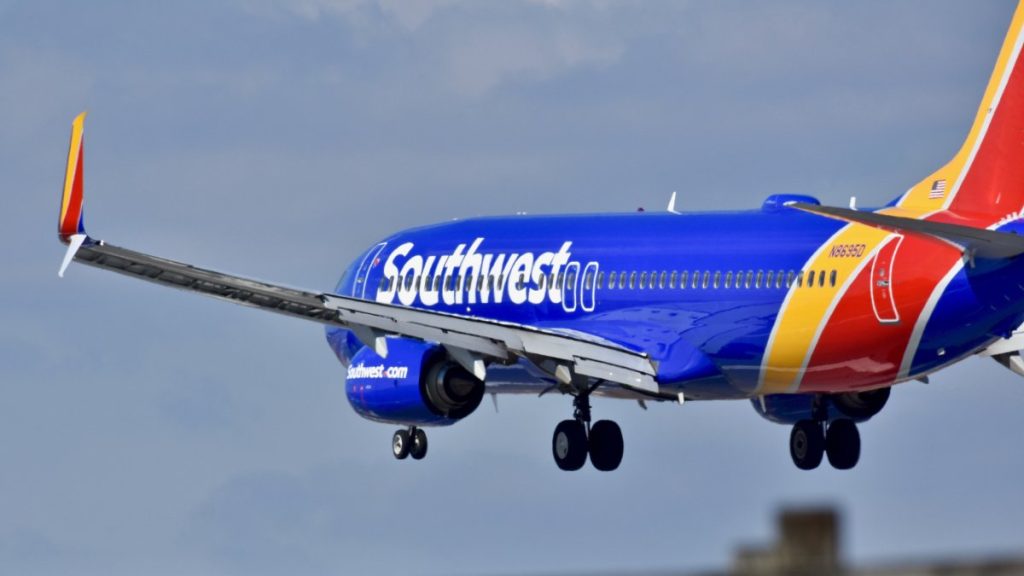 Woman arrested for trying to open door on Southwest Airlines flight mid-flight - NBC Houston